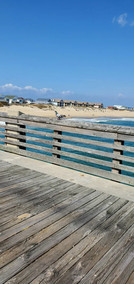 the ocean side boardwalk extends to the beach