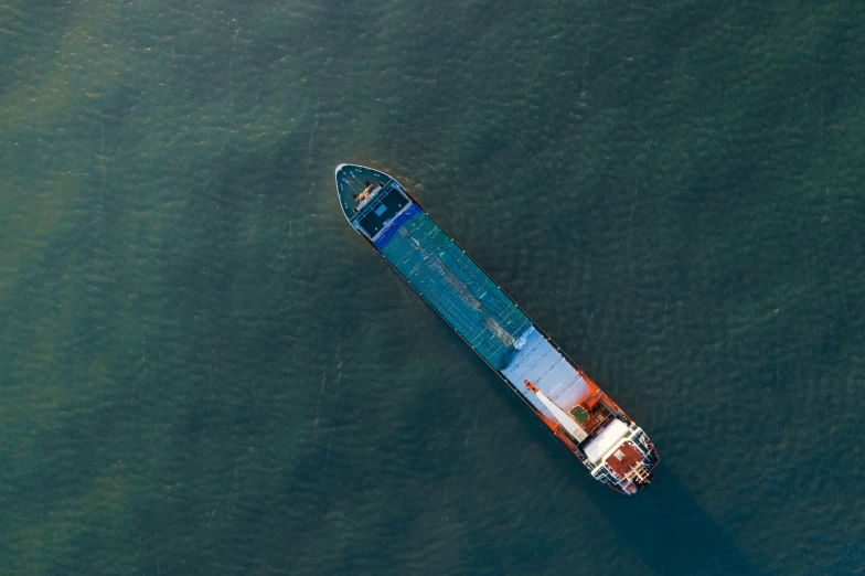 a boat traveling on water with no one in it