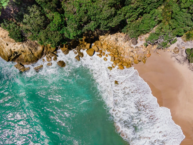 aerial po of wave moving on shore near coastline