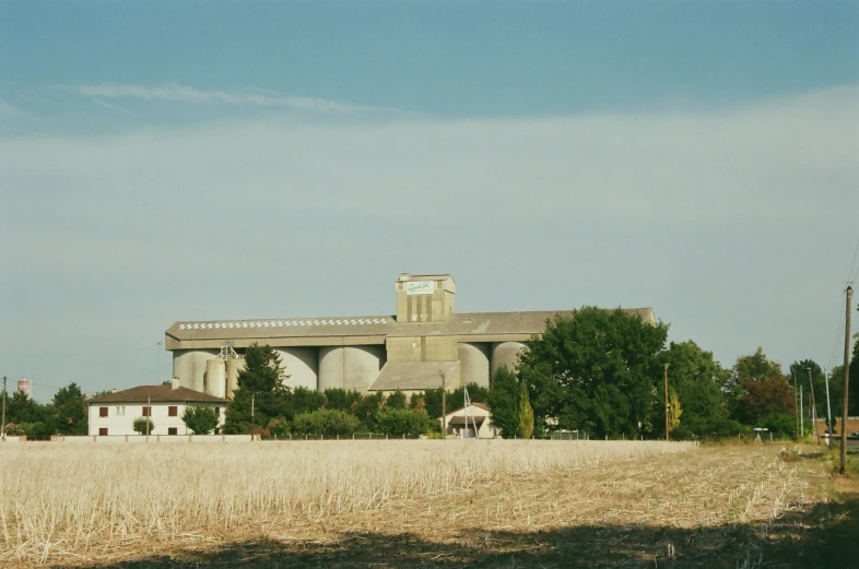 the barn is big in size as it stands out in the distance