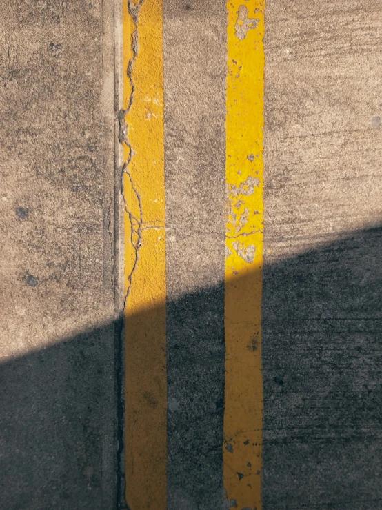 a close up view of the street painted yellow