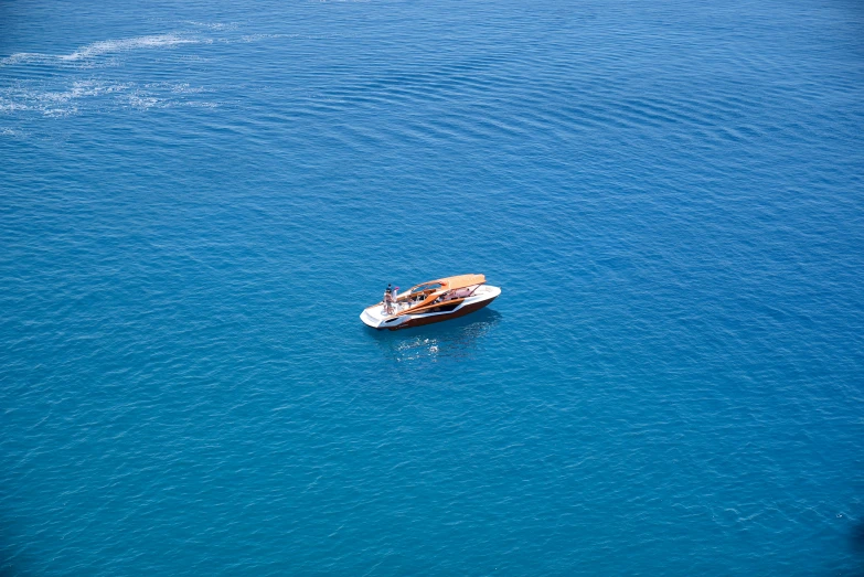 a motor boat in the middle of the ocean