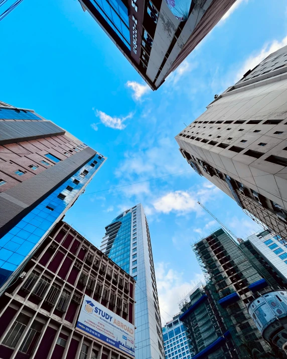 a group of skyscrs rise into the sky in the city