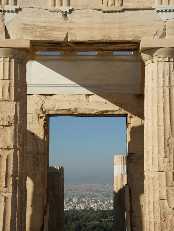 an arch in front of the ruins looking down