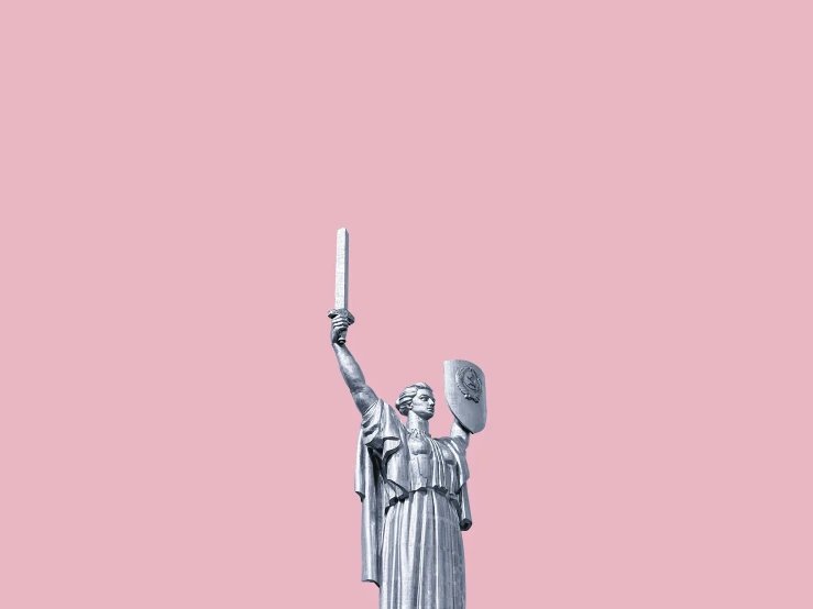 statue with a pink background holding a torch