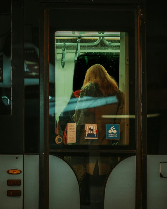 a person riding a public bus at night