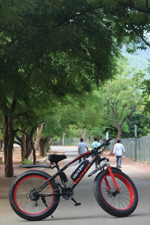 a fat bike that is parked on the side of a road