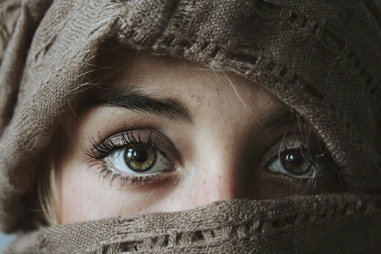 a close - up of a person with long lashes wrapped around them