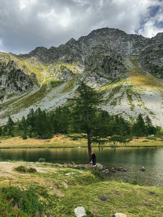 the view of a large mountain range with a lake in front of it