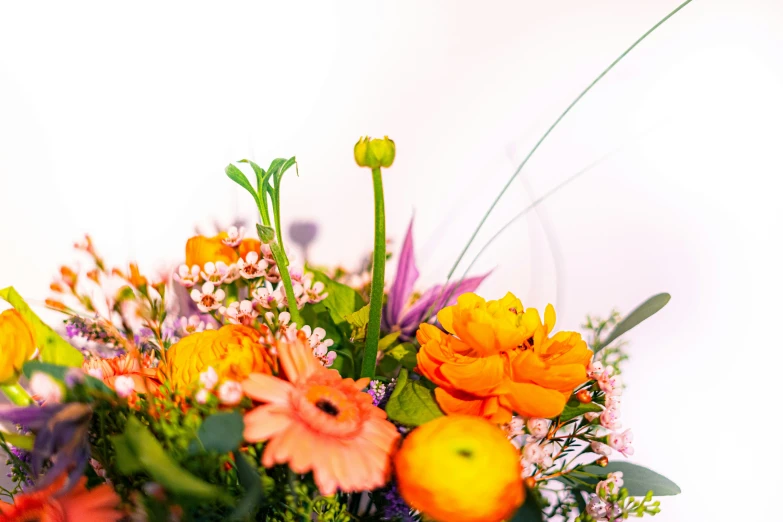 the yellow flowers are displayed on the table