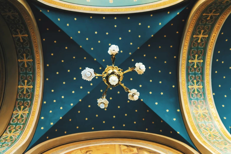 the ceiling in the church with floral decorations and gold detailing