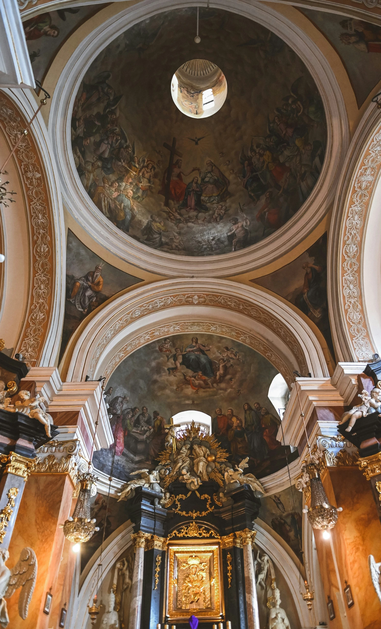 a view of the ceiling and painted interior of a church