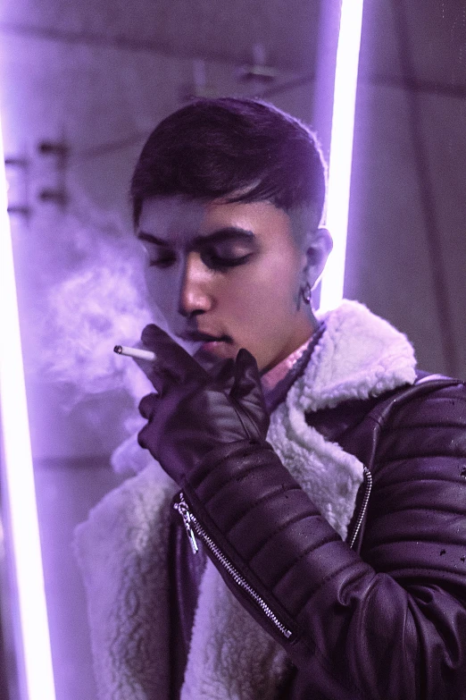 a person in a dark room smoking a cigarette