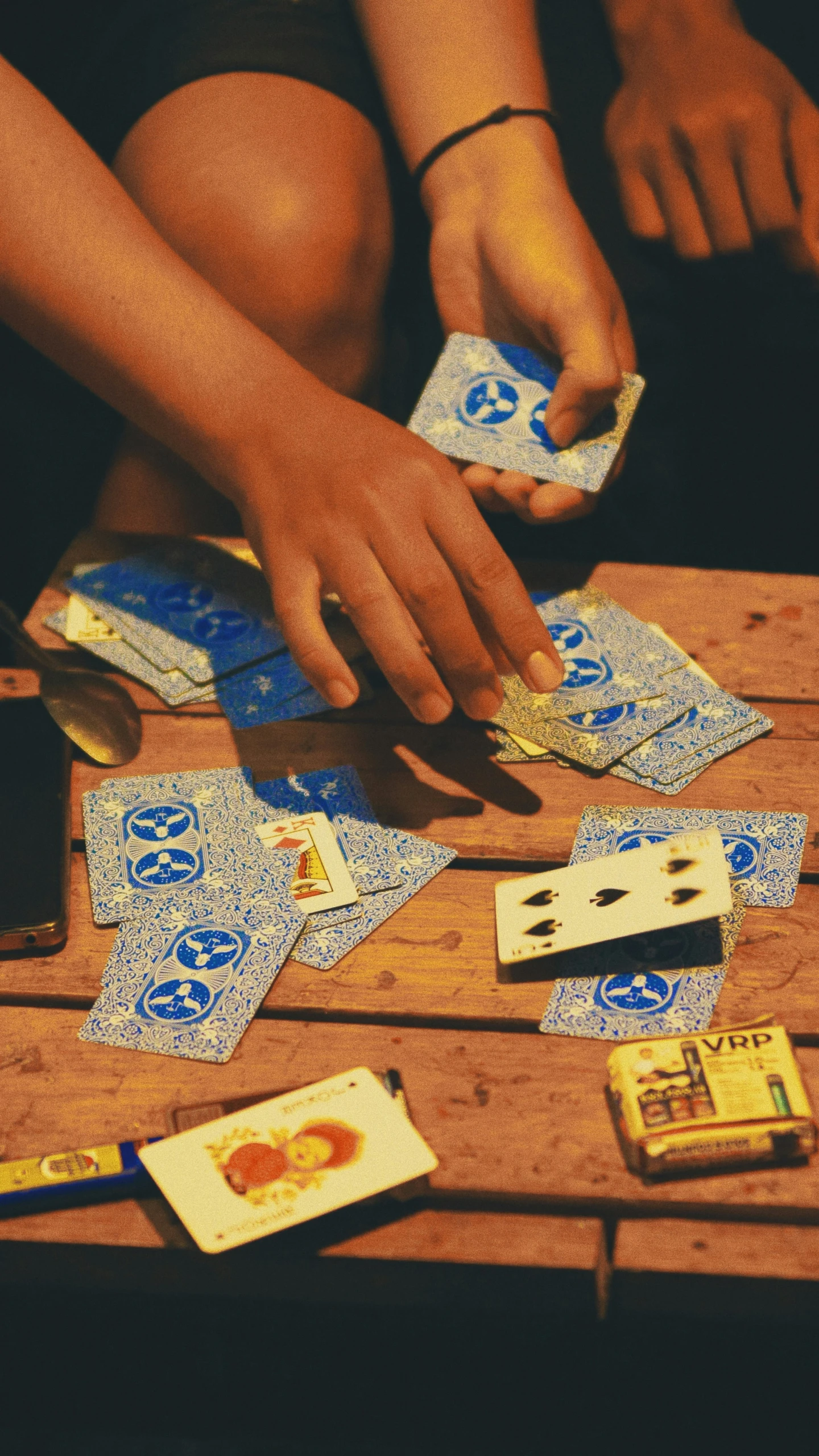 a person is reaching for a set of cards