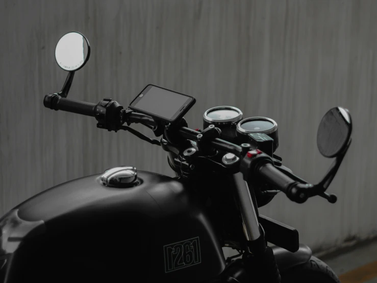 the handlebars and back lights on a motorbike