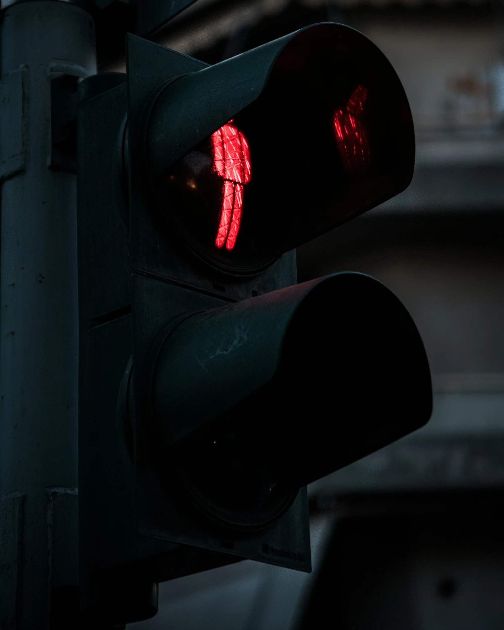 a traffic light shows red as it is glowing red