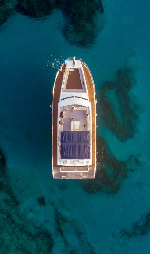 aerial view of the deck of a large boat on clear water