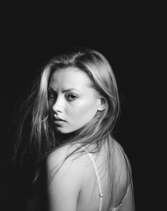 a black and white po of a woman with long hair