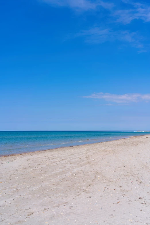 there is an empty beach on the ocean