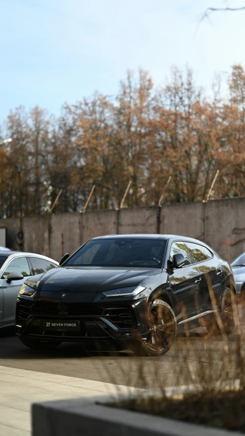 a bunch of cars parked on the street next to a building