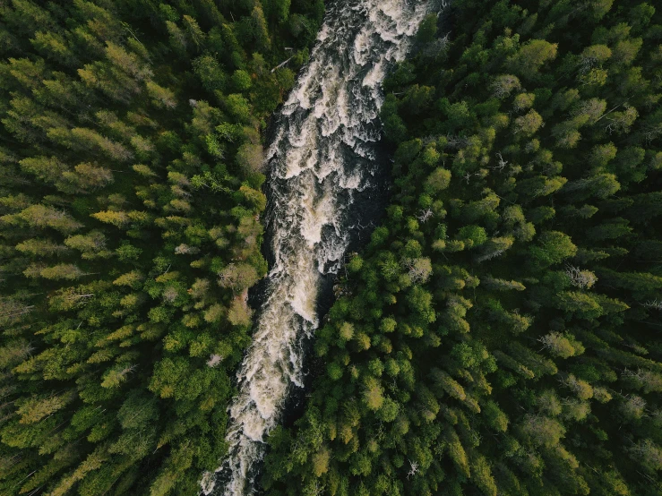 an aerial view of a waterfall from above