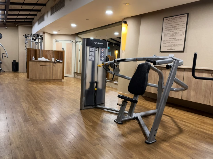 an empty gym with a few machines