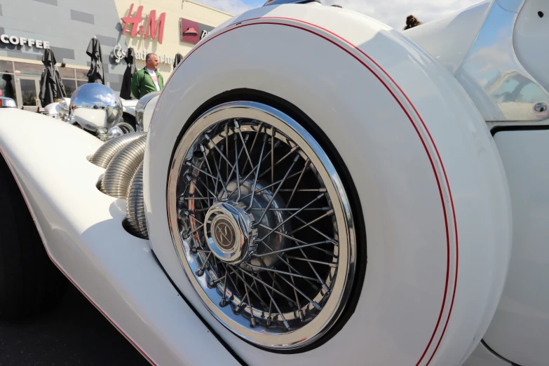 wheels and tires on a white vintage car