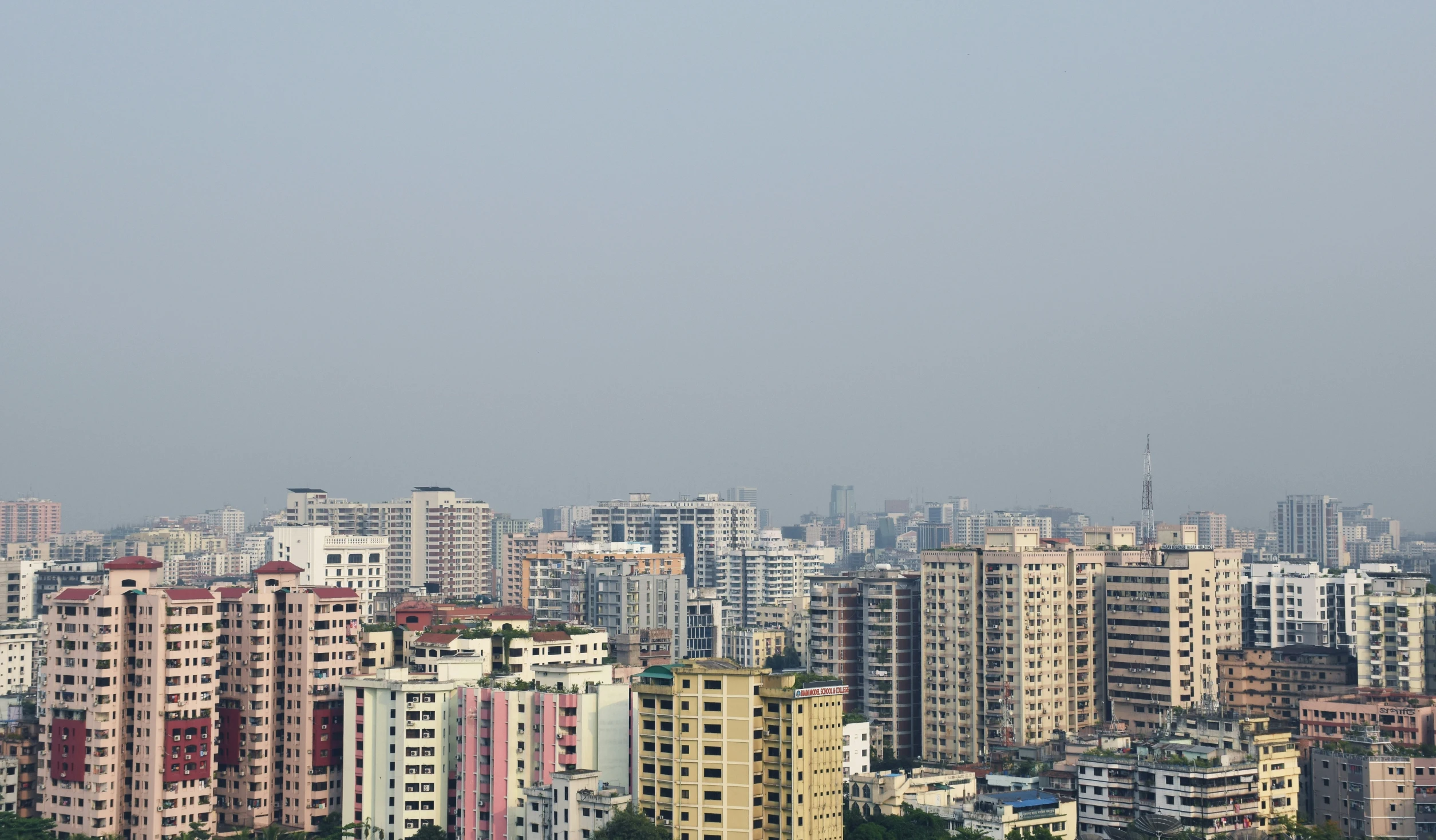 some buildings an trees and sky in the distance