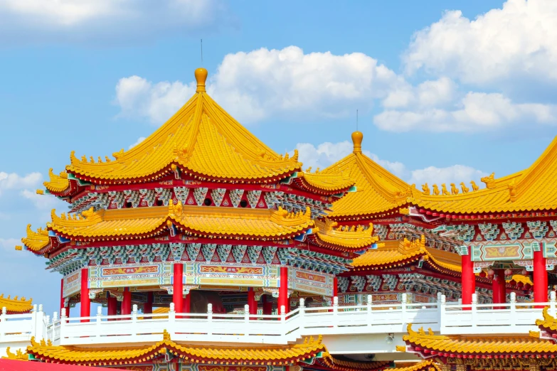 several large red and yellow buildings with gold trim