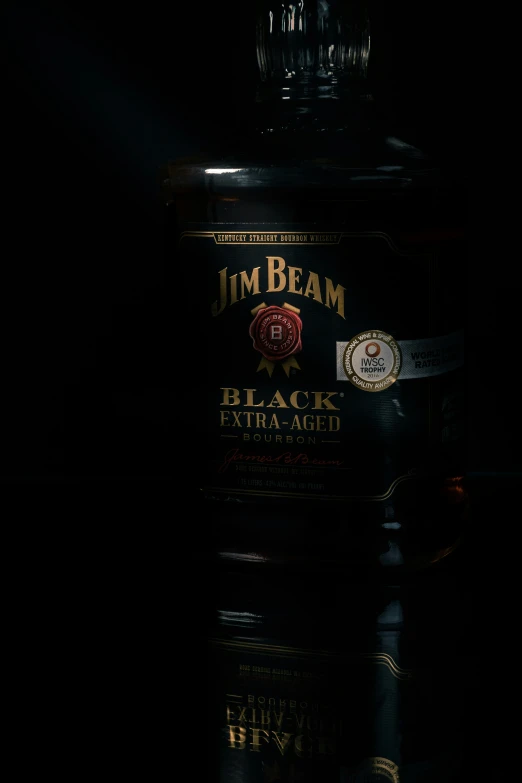 bottle of rum beam black strength on dark background