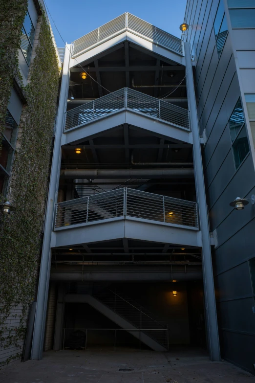 a tall building has a second story with stairs leading up