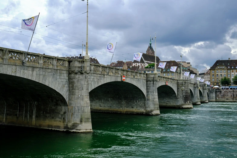 the bridge is in the water that is green