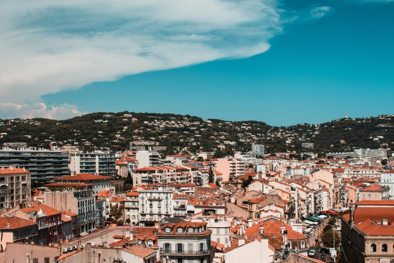 a view of buildings and city on hillsides