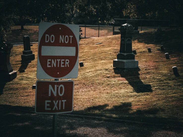 two signs that say don't enter and no exit