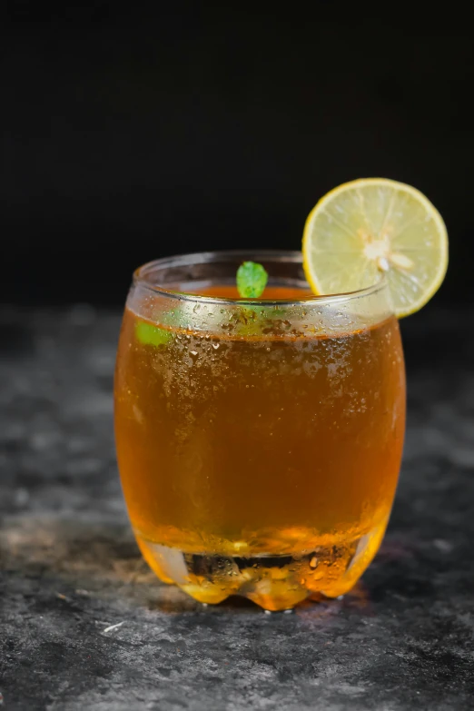 a small glass with a drink on a table