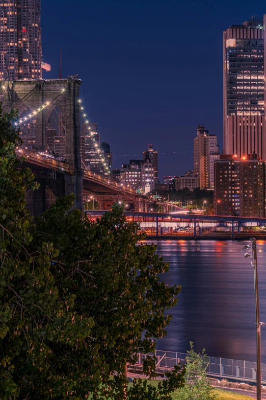 a view of the city lights and lights reflecting off the water