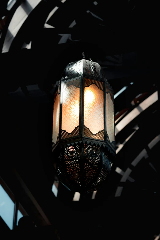 a light fixture in a building against a background of abstract shapes