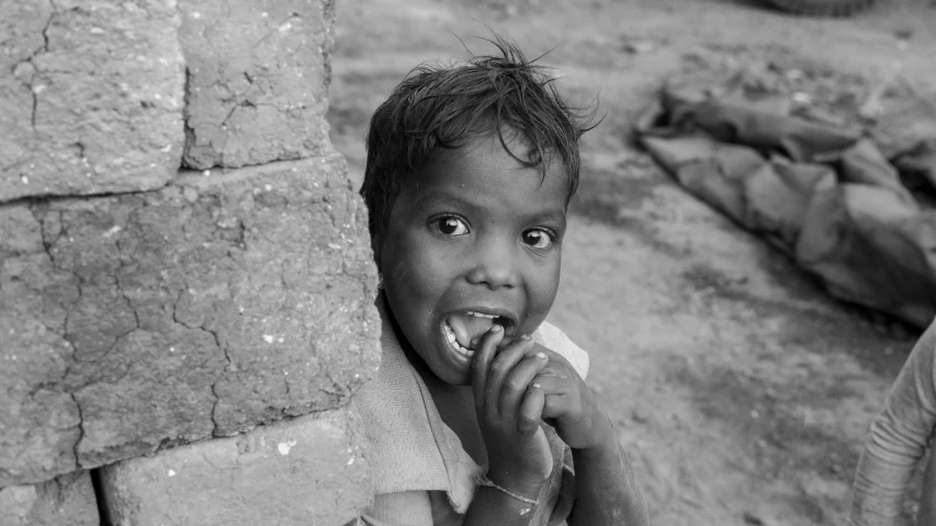 a  standing with food in his mouth