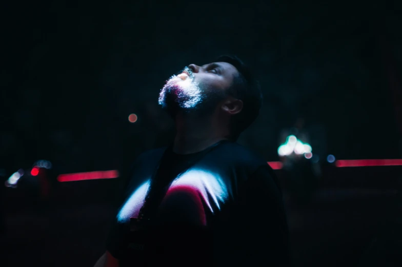 a man with a beard and some lights on