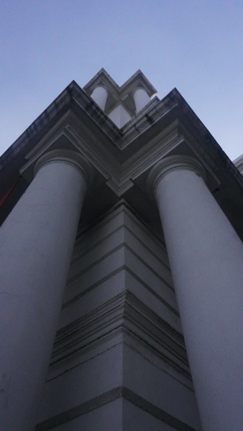 a building with many pillars is shown from below