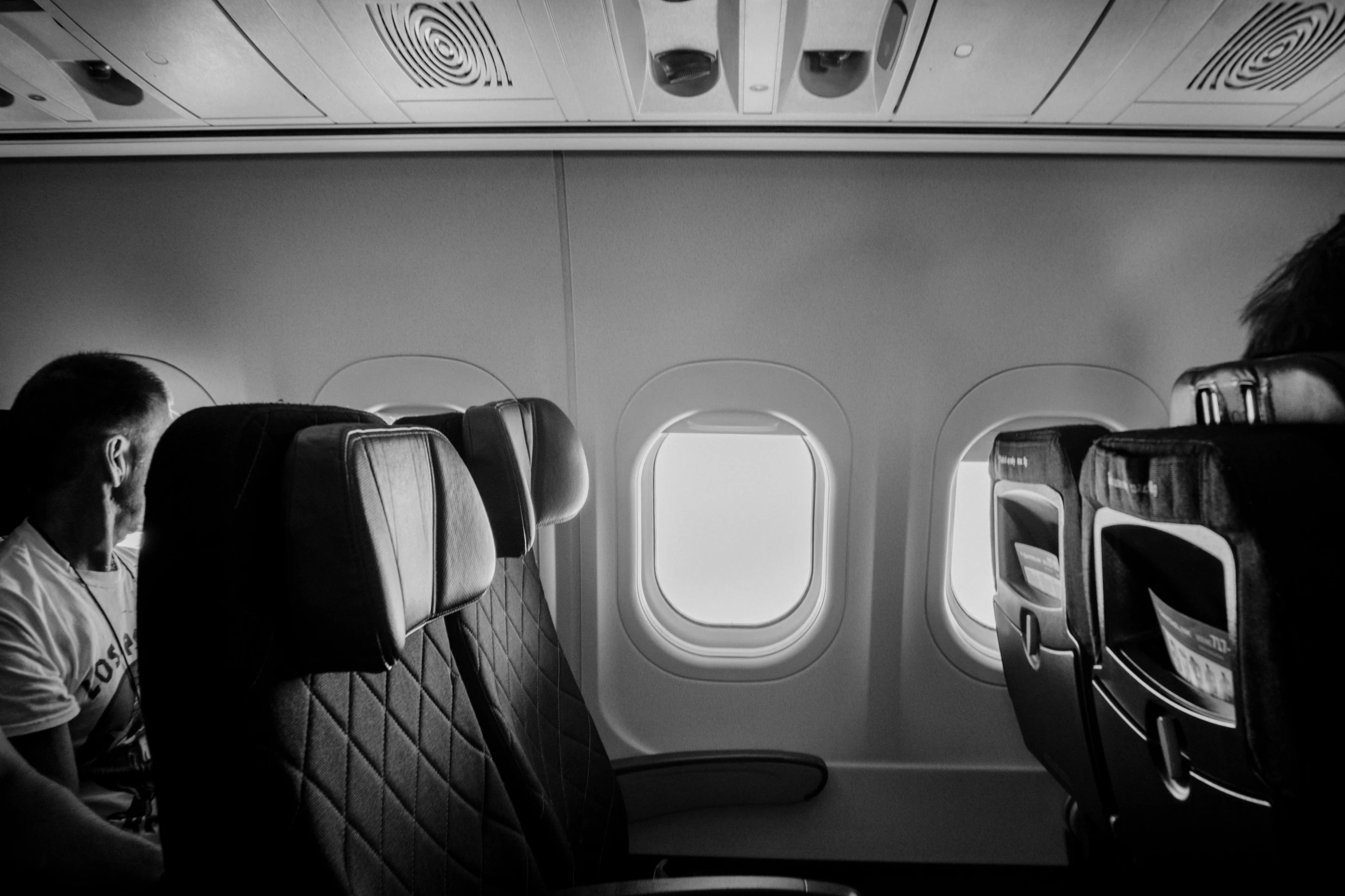 a black and white po of an airplane with seats