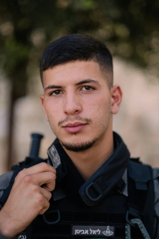 a man wearing an army uniform posing for a po