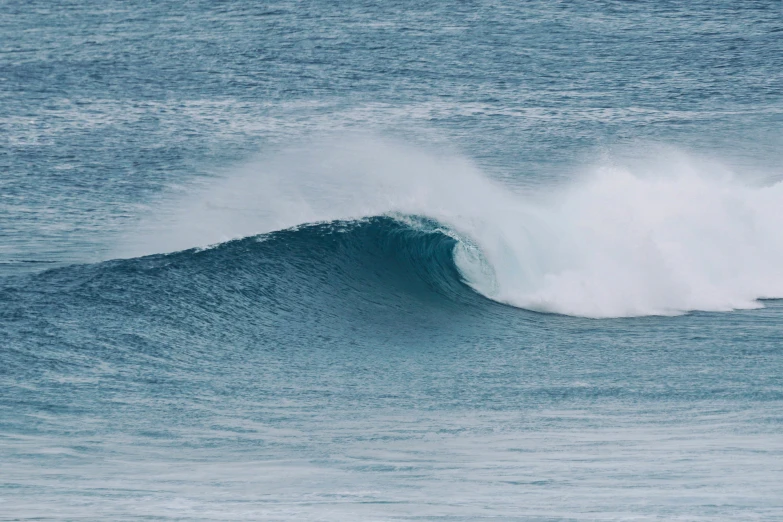 a large wave coming in close to shore