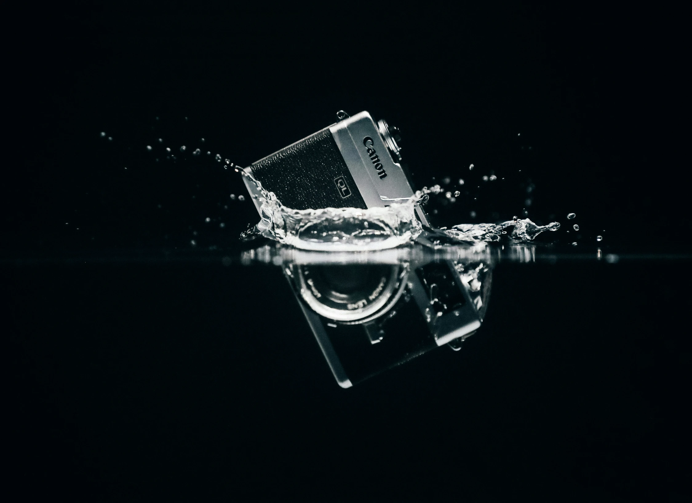 a po of a nintendo entertainment system splashing into the water