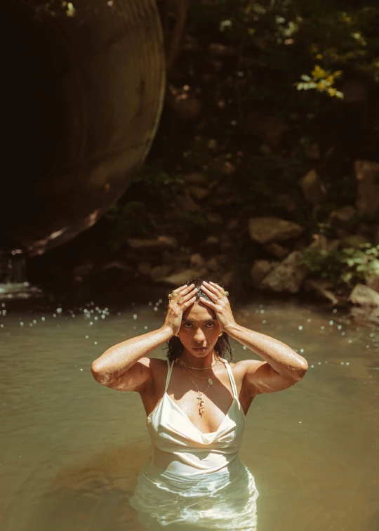 a woman wearing a bikini in a body of water