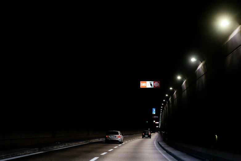 a street in the middle of the dark at night