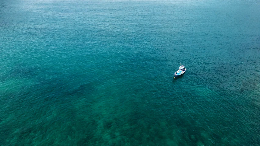 a boat traveling on a large body of water