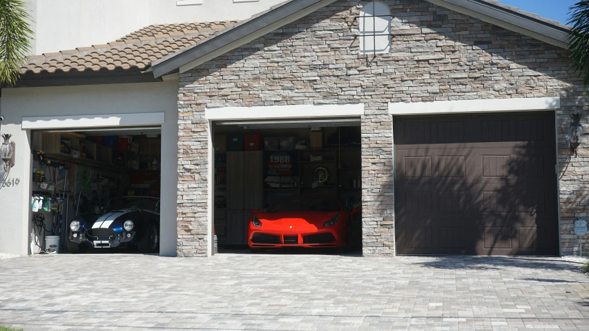 there is a garage with an orange car parked in the garage