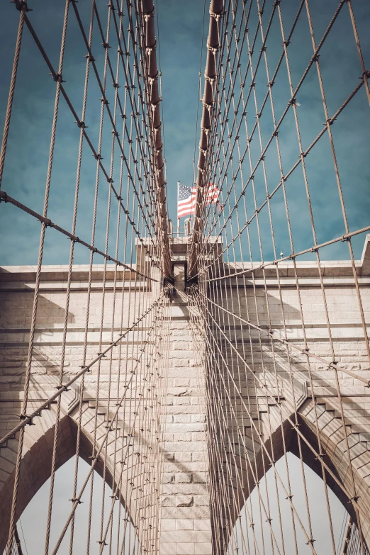 looking down on the suspension of a bridge