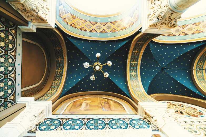 this ornate ceiling is decorated in blue, gold, and white